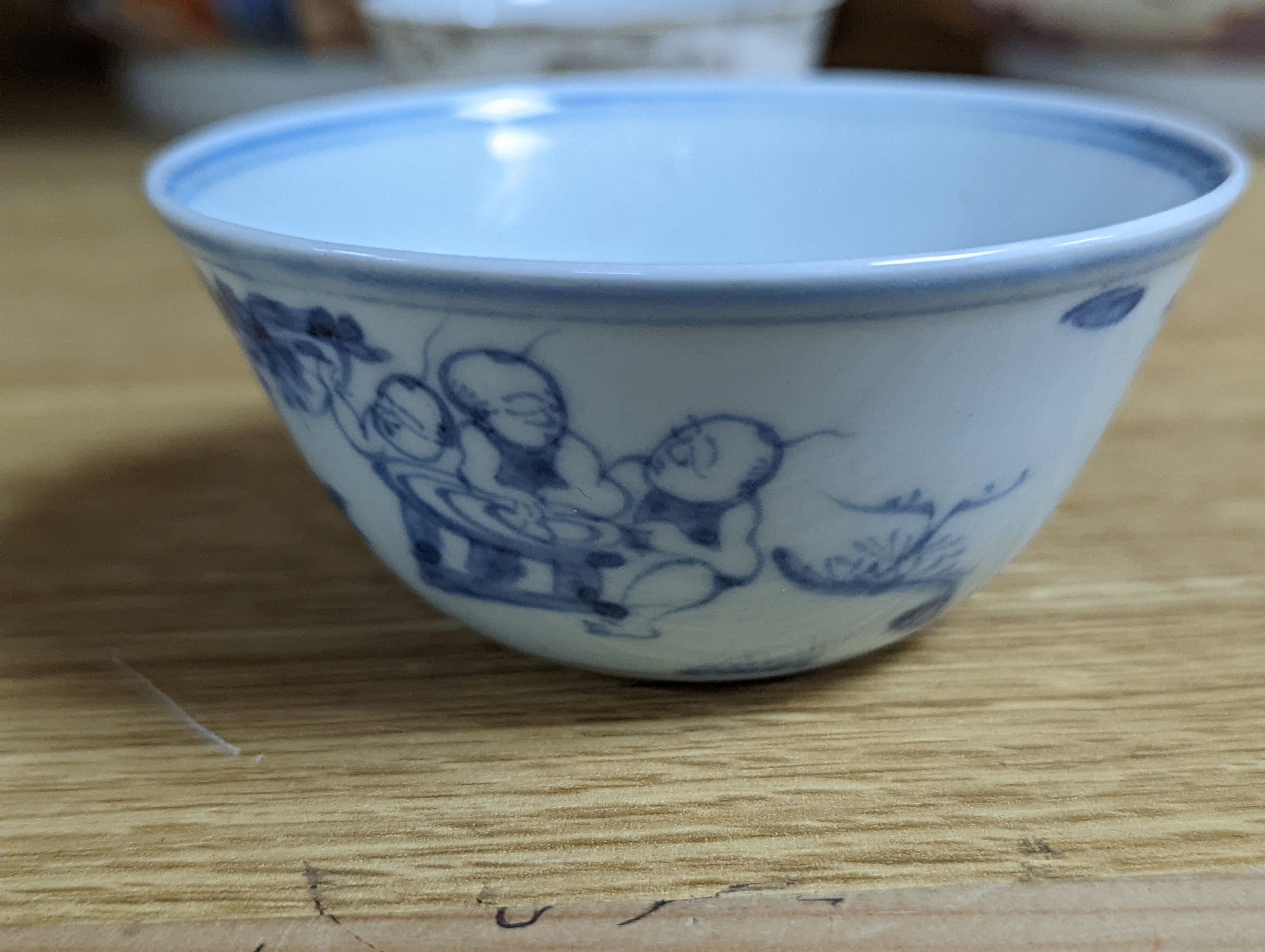 Two 18th century Chinese export bowls, a similar tea bowl and another Chinese blue and white tea bowl, largest 20cm diameter